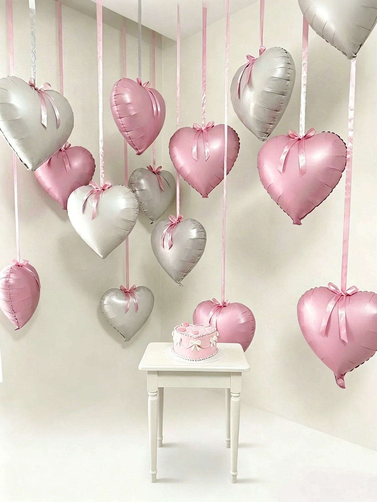 This 11-piece heart-shaped foil balloon set includes 18-inch pink and white heart-shaped balloons. Suitable for wedding parties