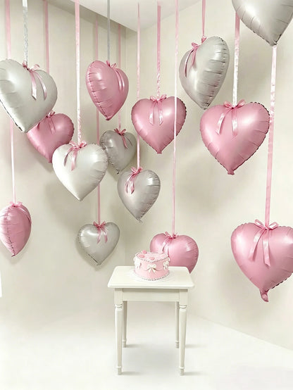 This 11-piece heart-shaped foil balloon set includes 18-inch pink and white heart-shaped balloons. Suitable for wedding parties